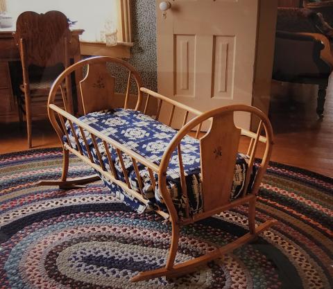 Cradle in the bedroom at the Willa Cather Childhood Home