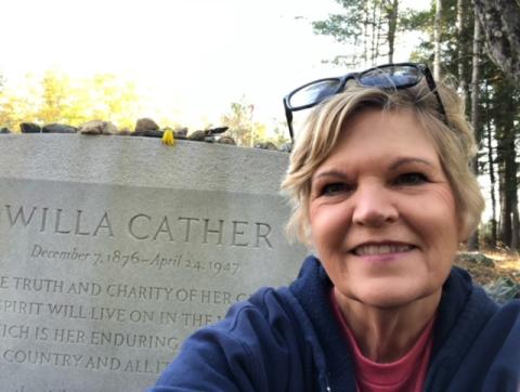 Sharon Kohout at Willa Cather's grave in Jaffrey, NH